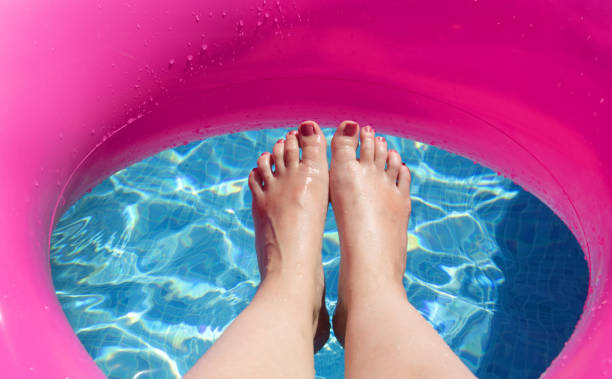 istock woman relaxing on a pool 1178390262