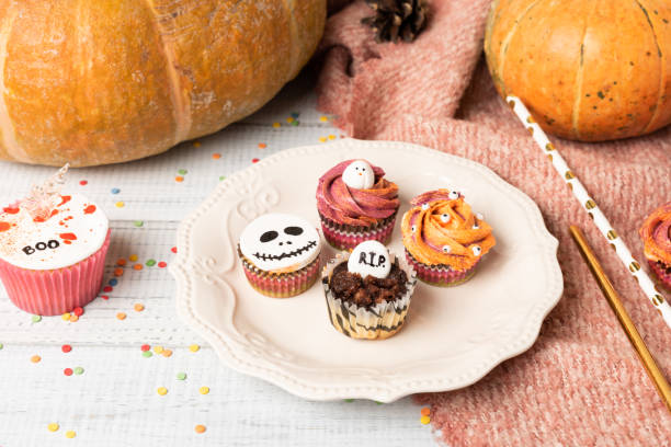 istock Festive Halloween cupcakes decorated colored decorations witch boo text on hatchet 1178390288