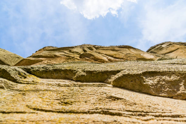 high mountain wall with a blue cloudy sky, Nature background