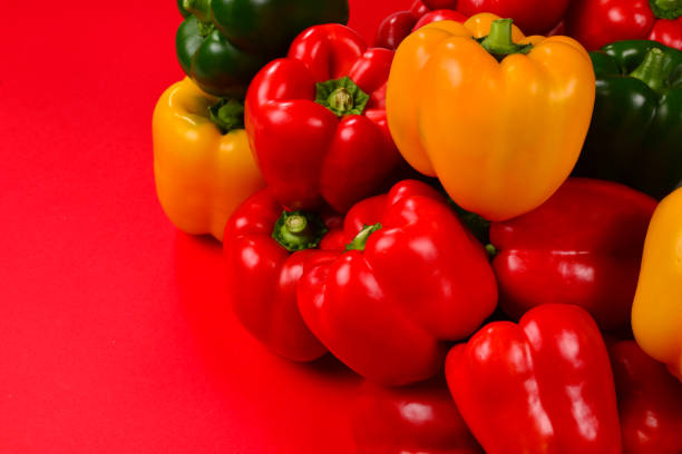 istock Fresh red, yelow, green bell pepper on a red background. 1178392923