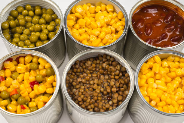 istock Canned food on white background. Green pea, beans, corn, lentils. 1178393087