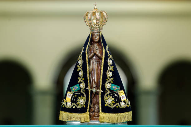 Image of Our Lady of Aparecida - Statue of the image of Our Lady of Aparecida Statue of the image of Our Lady of Aparecida, mother of God in the Catholic religion, patroness of Brazil pilgrimage photos stock pictures, royalty-free photos & images