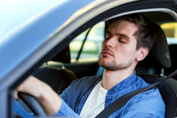 istock Tired man drives a car 1178397533