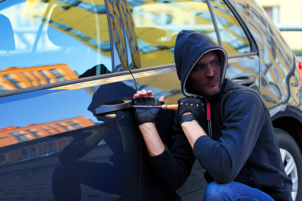 istock Man vandal damaging car 1178397572