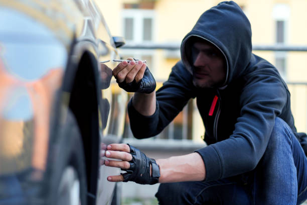istock Man vandal damaging car 1178397744