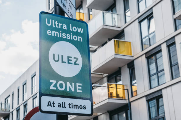 Ultra Low Emission Zone (ULEZ) sign on a street in London, UK. Signs indicating Ultra Low Emission Zone (ULEZ) on a street in London, UK. fumes photos stock pictures, royalty-free photos & images