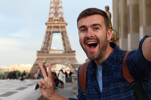 Cute tourist taking a selfie in France.
