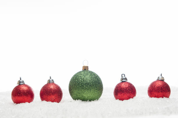 istock red and green christmas balls lying on snow 1178406652