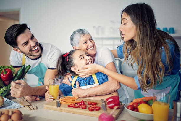 istock Happy family is cooking together in kitchen 1178409670