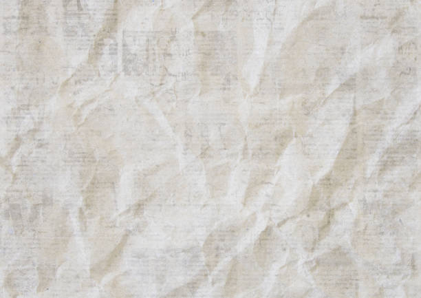 Newspapers vintage grunge paper background. Blurred old newspaper texture. A blur unreadable crumpled aged news paper page with place for text. Grey colored collage.