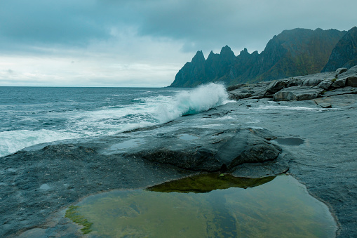 Okneset and Ersfjord from Tungeneset on a stormy day with breaking waves and spray
