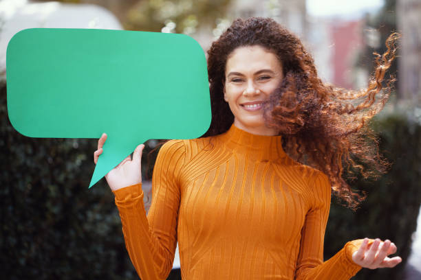 istock Young woman holding a chat bubble 1178419358