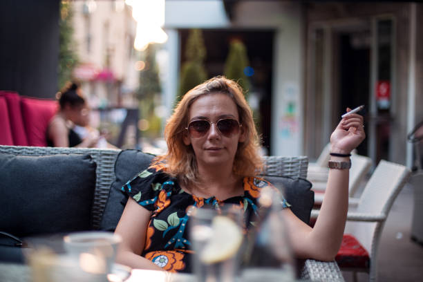 istock Woman smoking in a coffee chop 1178421235