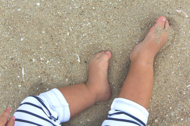 Close up of feet of little girl with painted toenails