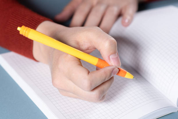 istock Woman is writing by a ballpen. 1178424487