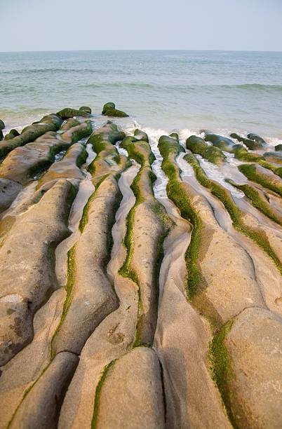 Costa erosione delle onde - foto stock