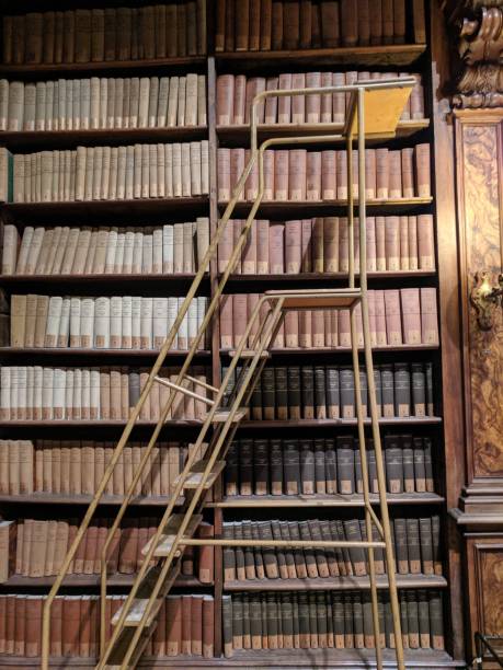 istock Library with old books and staircase 1178425634
