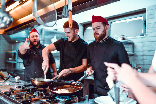 istock Male Chef Shouting At Cooks To Stop Making Mistakes 1178425654