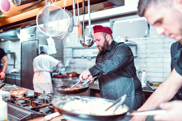 istock Everyone In The Kitchen Doing Their Own Role 1178425781
