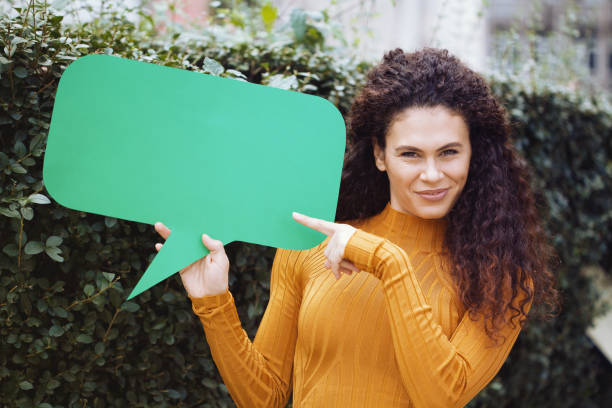 istock Young woman holding a chat bubble 1178426427