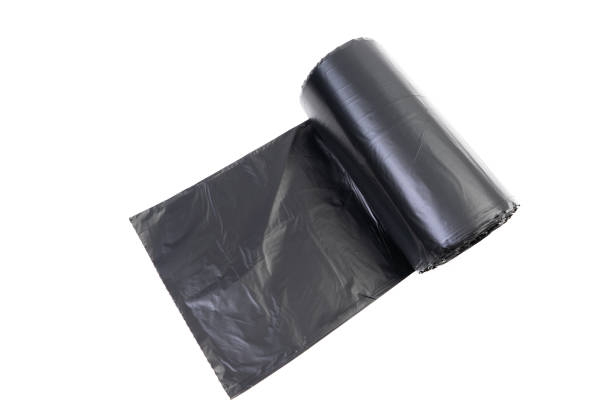 istock Roll of black trash bag on white background 1178448145