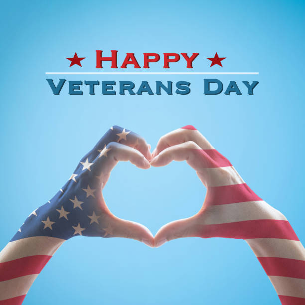 istock Happy Veterans day with American US flag pattern on people hands in heart shape 1178451201