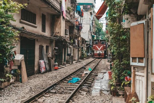istock A train run through an ancient town in Hanoi. 1178451339