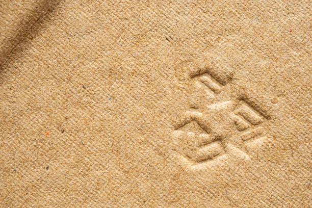 istock recycle sign on brown cardboard paper texture background 1178451509