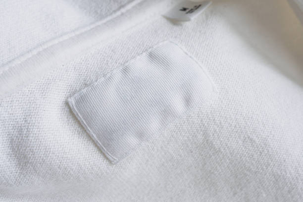 istock Blank white clothes label on new cotton shirt background 1178451519