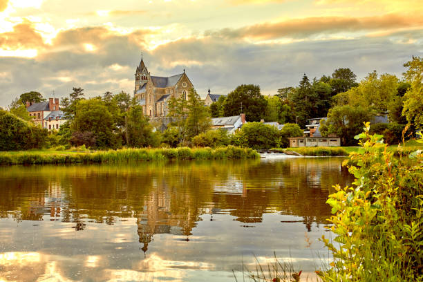 Image of Betton, Brittany France with the church and lake.