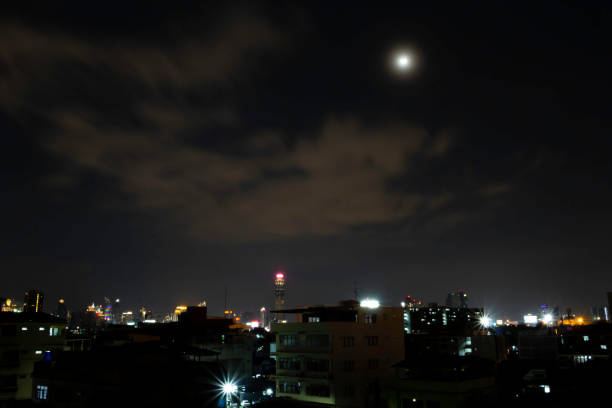 istock Peaceful city at night with the sky and the bright moon 1178452086