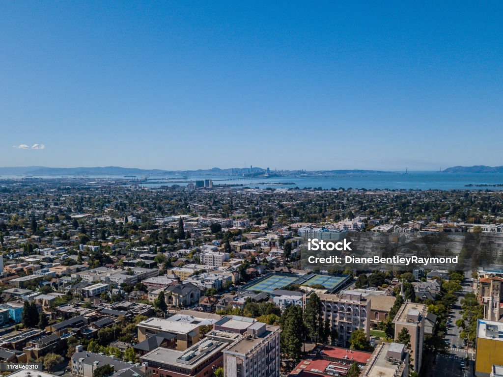 Aerial view of Berkeley with San Francisco Skyline Aerial view of Berkeley looking straight across the Bay to the San Francisco Skyline. Beautiful, clear sunny day with Bay Bridge, Golden Gate Bridge, downtown Berkeley and the San Francisco Skyline in view. Berkeley - California Stock Photo