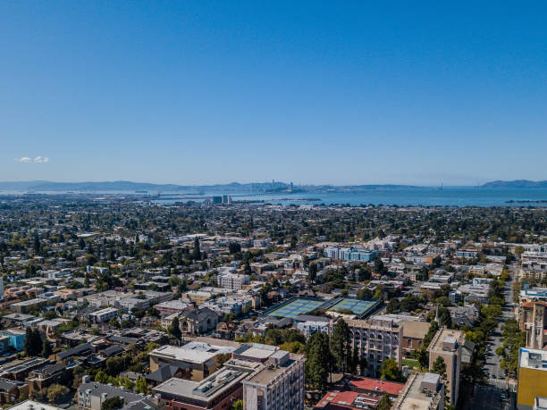 Aerial view of Berkeley with San Francisco Skyline Aerial view of Berkeley looking straight across the Bay to the San Francisco Skyline. Beautiful, clear sunny day with Bay Bridge, Golden Gate Bridge, downtown Berkeley and the San Francisco Skyline in view. berkeley california stock pictures, royalty-free photos & images
