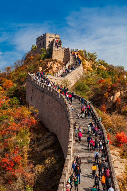 Beijing, China - October 1, 2019: Upward View of a Fort on the Great Wall of China in the Mountains on a Clear Autumn Day Autumn view of a fort on the Great Wall of China in Badaling, near Beijing in China. badaling stock pictures, royalty-free photos & images