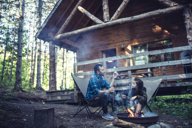 istock Father and daughter  cooking marshmallows on campfire 1178464411
