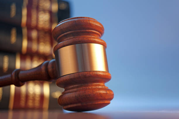 istock Gavel Resting In Front of A Stack Of Law Books 1178467001