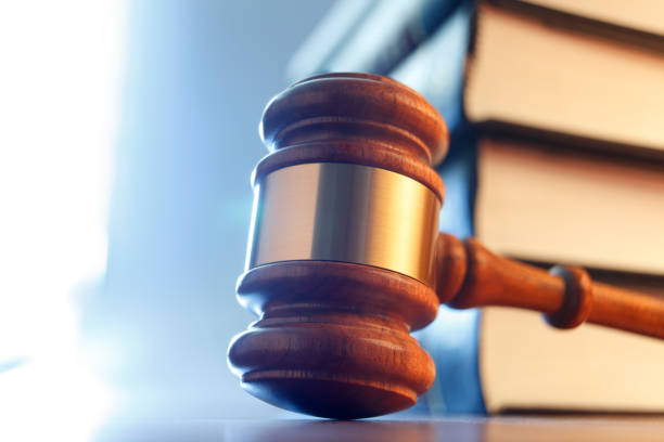 istock Gavel Resting In Front of A Stack Of Law Books 1178467019