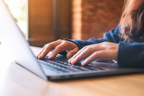 istock a woman working and touching on laptop touchpad on the table 1178469360