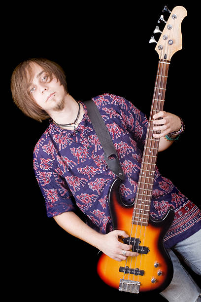 istock The young man with a guitar over black 117847221