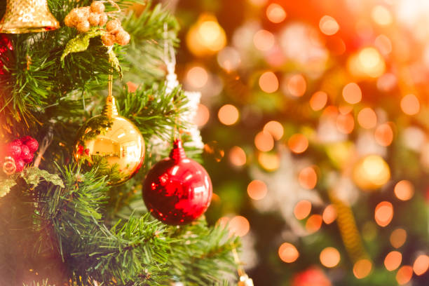 istock Christmas tree with decorations bokeh blurred glow. 1178473508