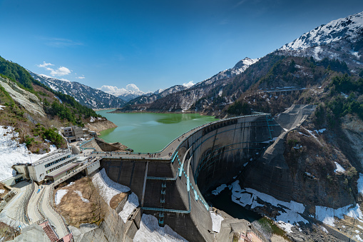 Wide angle view of Kurobe Dam, Kurobe Lake and hydropower station.