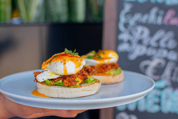 istock Mexican eggs benedictos brunch style with orange juice 1178481024