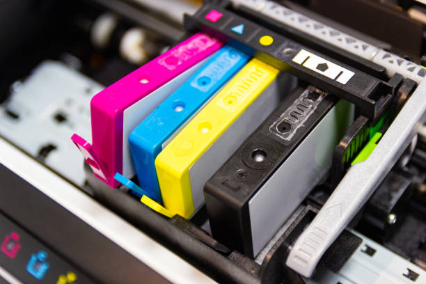 An ink cartridge or inkjet cartridge is a component of an inkjet printer that contains the ink four color stock photo