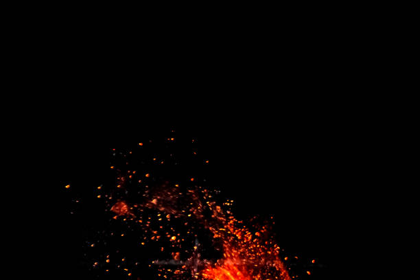 istock Sparks from a fire on a black background isolate. Concept fire grill heat weekend barbecue. 1178487591