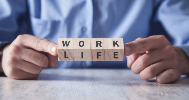 istock Man showing wooden cubes. Work Life Balance 1178487680