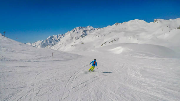 istock Heiligenblut - A skier going down a perfectly roomed slope 1178487719