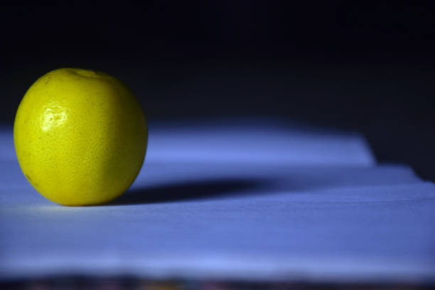 Fresh lemons on white paper with blur, Fresh ripe lemon concept