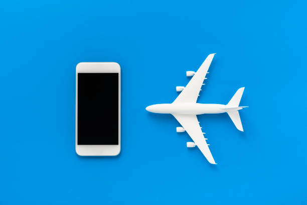 istock Miniature airplane and smartphone 1178489925