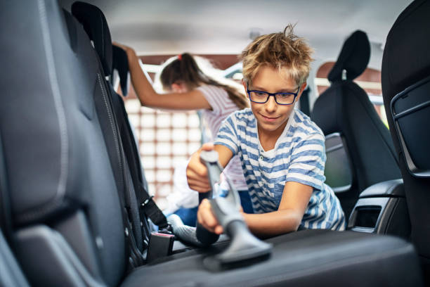 istock Kids cleaning car interior 1178490940