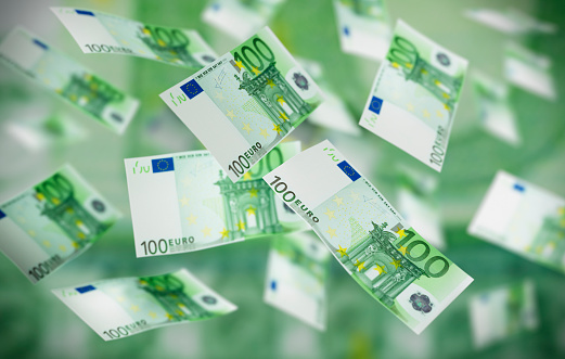 Large number of flying 100 Euro Banknotes in the air